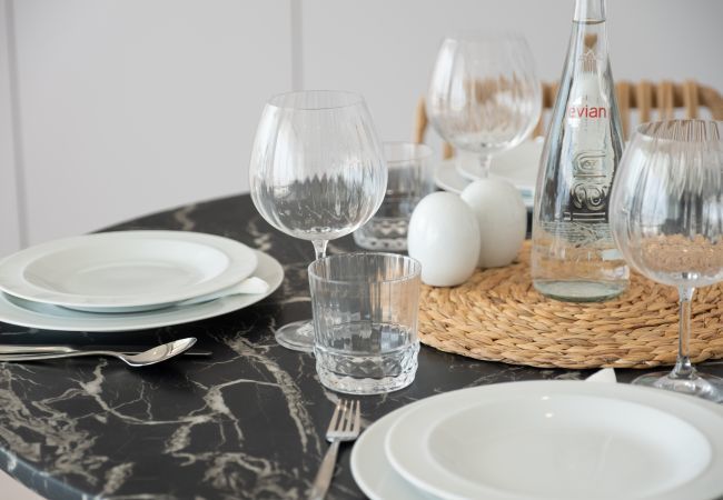 Dining table with plates and glasses