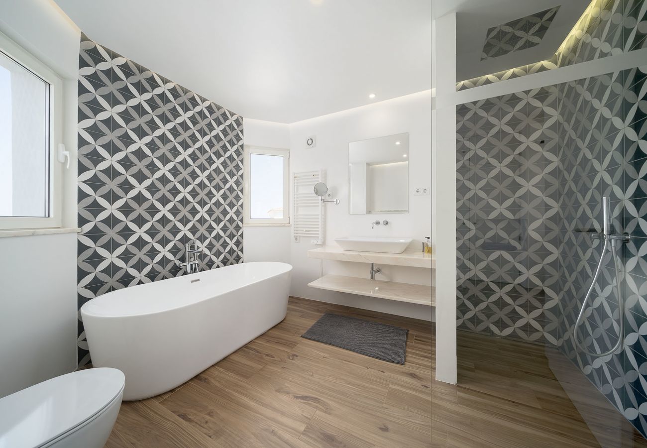 Bathroom with bathtub and shower