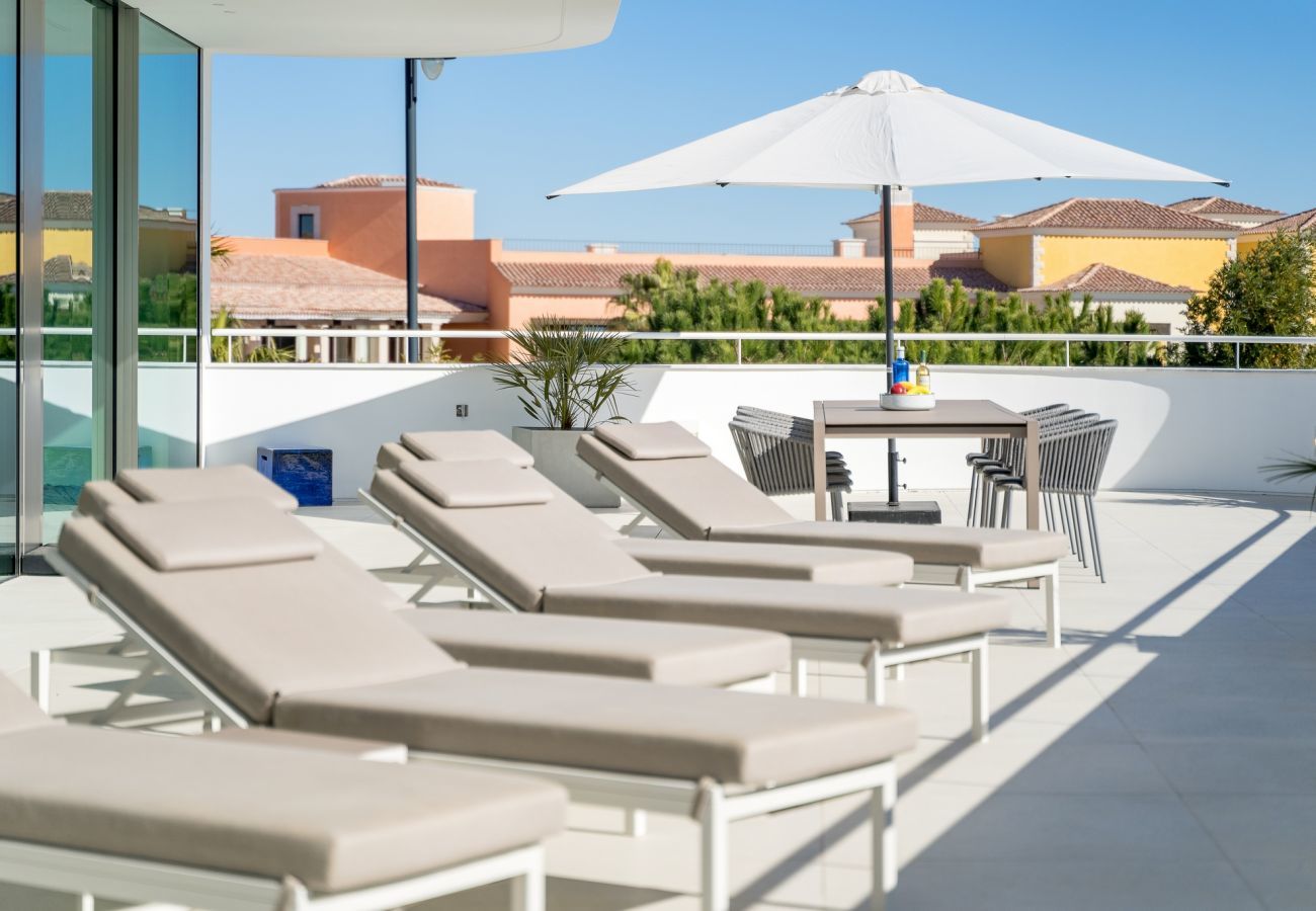 Sun loungers on the first floor terrace