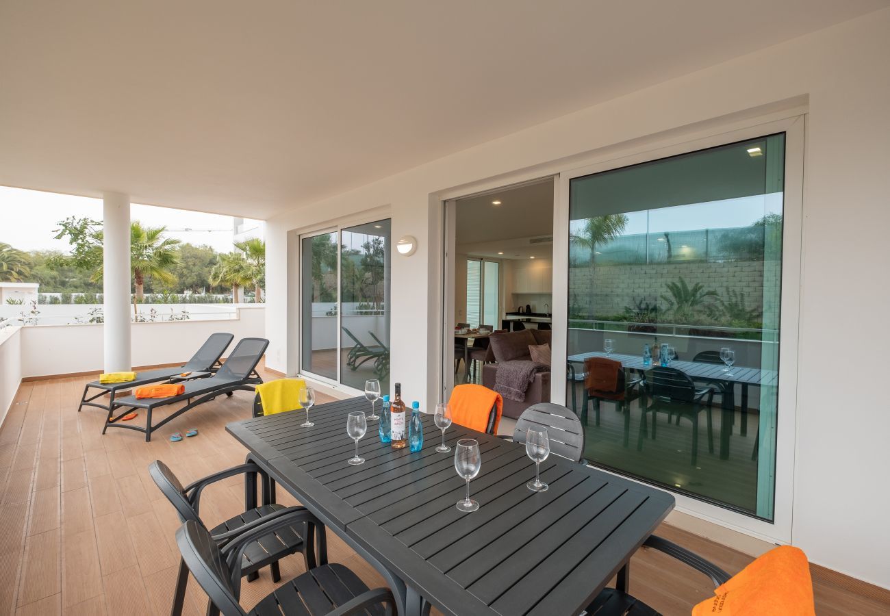 Outdoor table and sun loungers