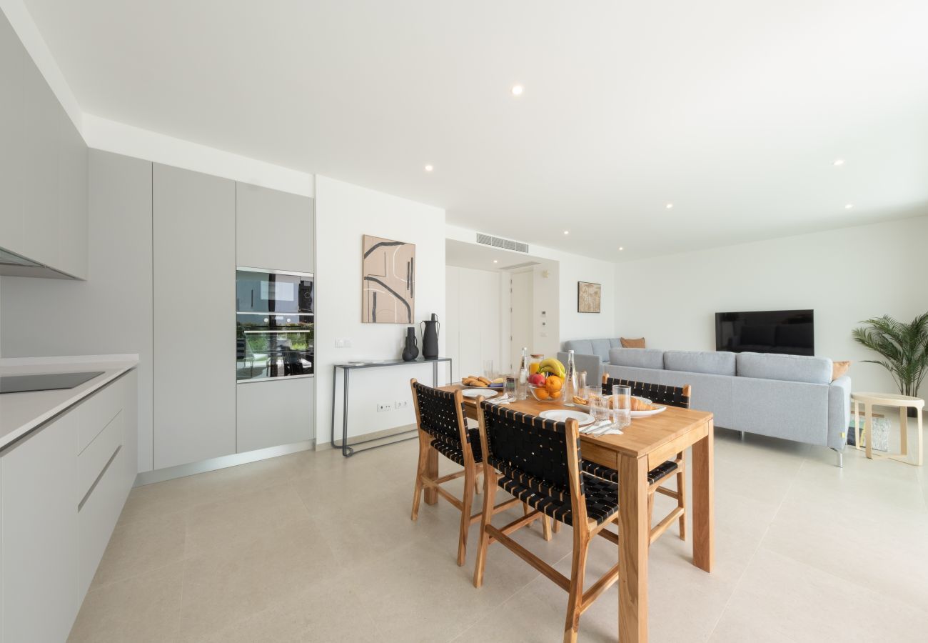 Kitchen, dining table and living room