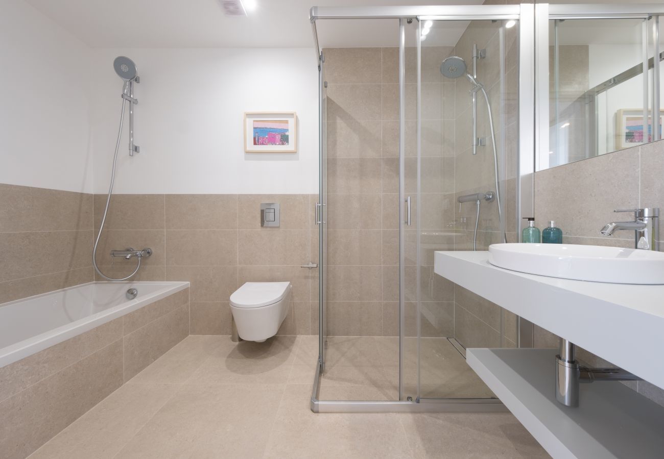Bathroom with shower and bathtub