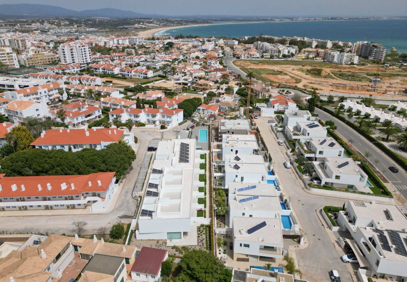 Aerial view of the condominium and surrounding area